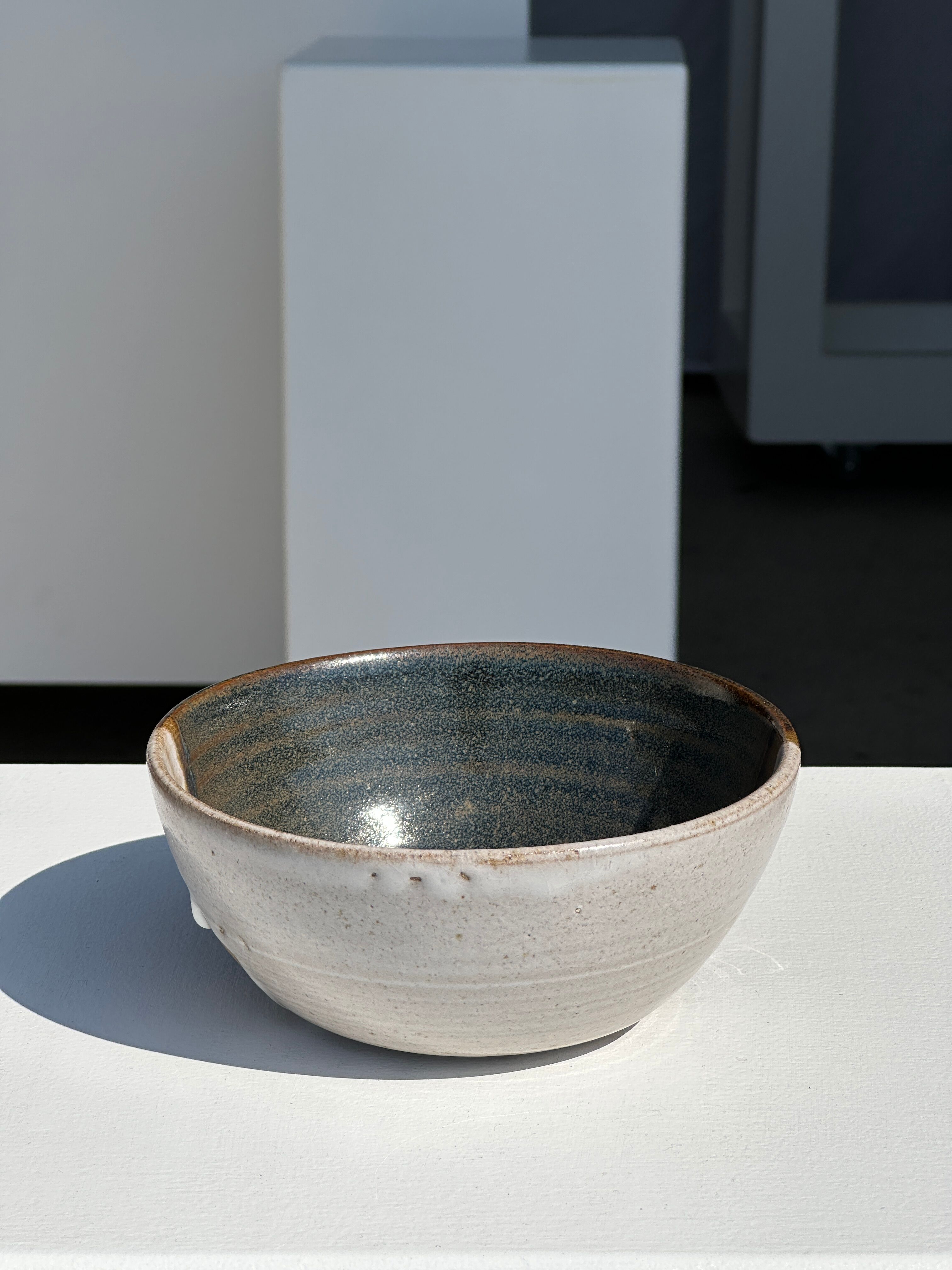 White and glossy brown two-tone ceramic bowl, matt earth