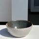 White and glossy brown two-tone ceramic bowl, matt earth