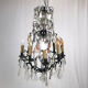 Black lacquered metal chandelier and crystal tassels