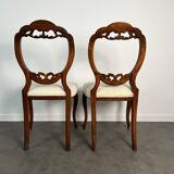 Pair of Victorian English chairs known as balloon chairs in solid mahogany.