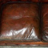 Pair of restored antique Chesterfield sofas in Boudreaux leather.