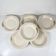 Set of 6 demi-deep plates from Longwy, early 20th century, floral decoration.