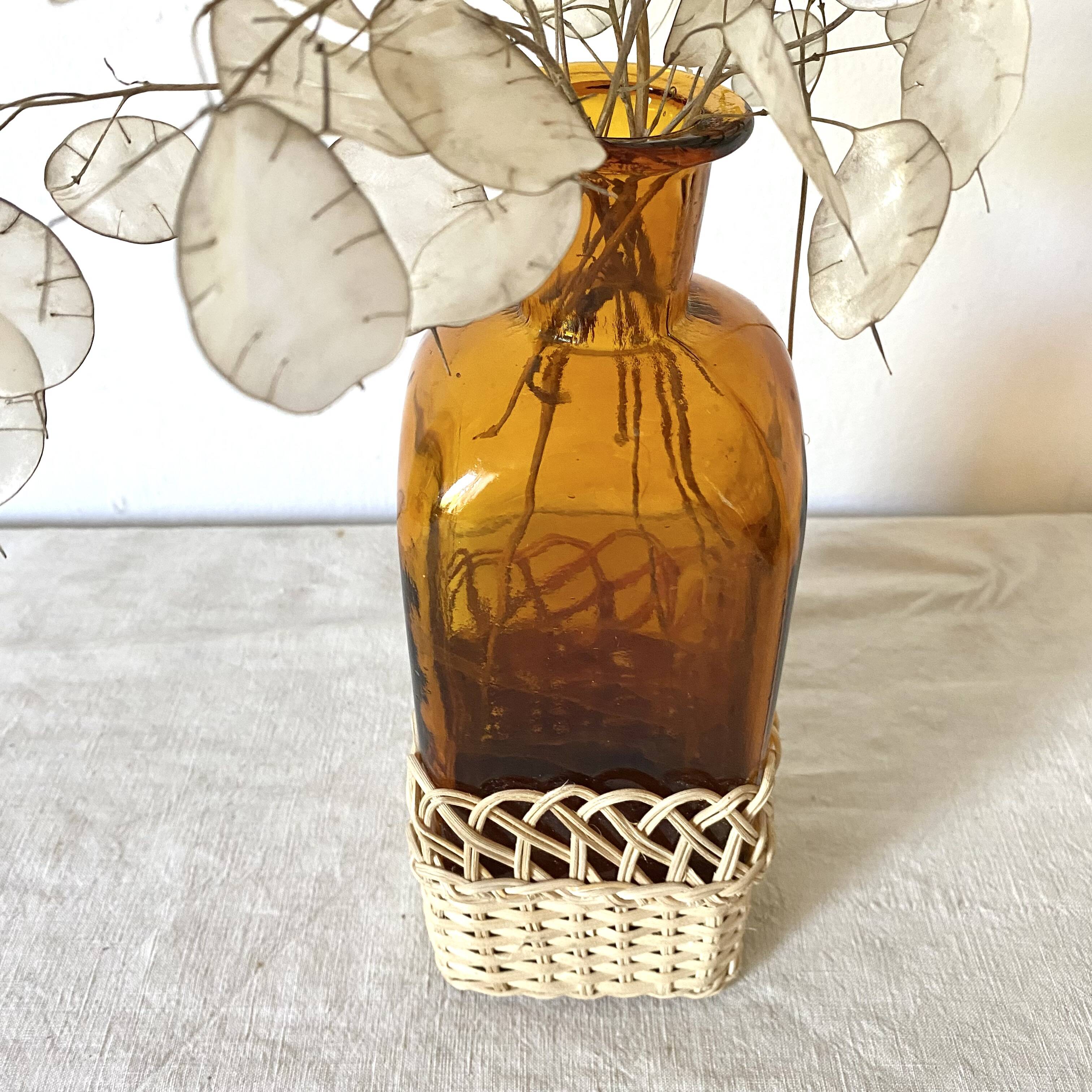 Amber glass and rattan carafe