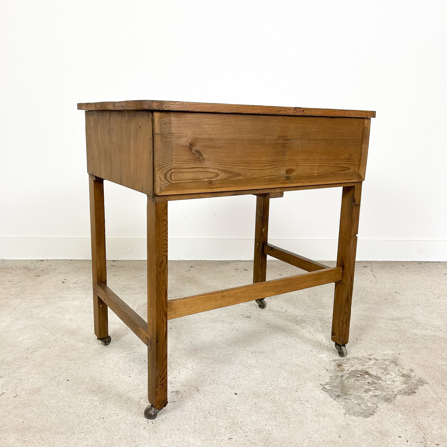 Vintage industrial wooden side table with drawers on casters