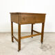 Vintage industrial wooden side table with drawers on casters