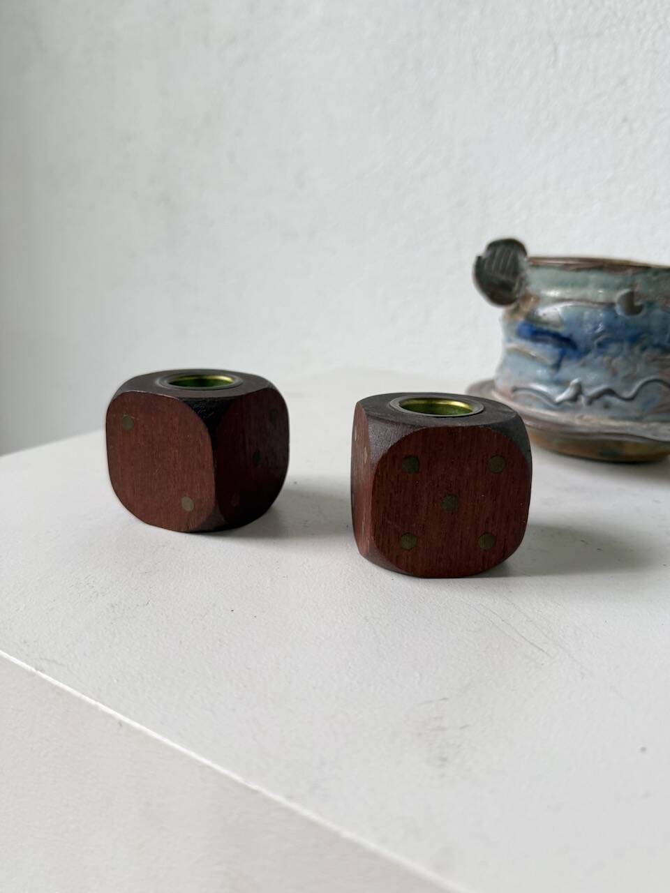Pair of 1960s teak and brass "dice" candlesticks