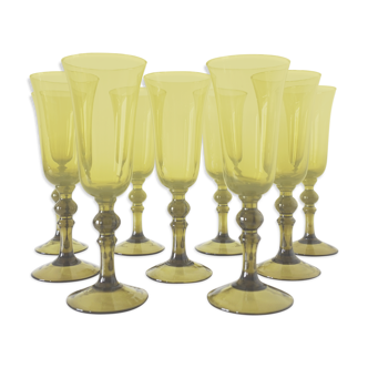 Lot of 9 champagne flutes in olive green blown glass