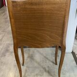 A bedside table with a drawer and a niche in Louis XV style.