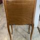 A bedside table with a drawer and a niche in Louis XV style.