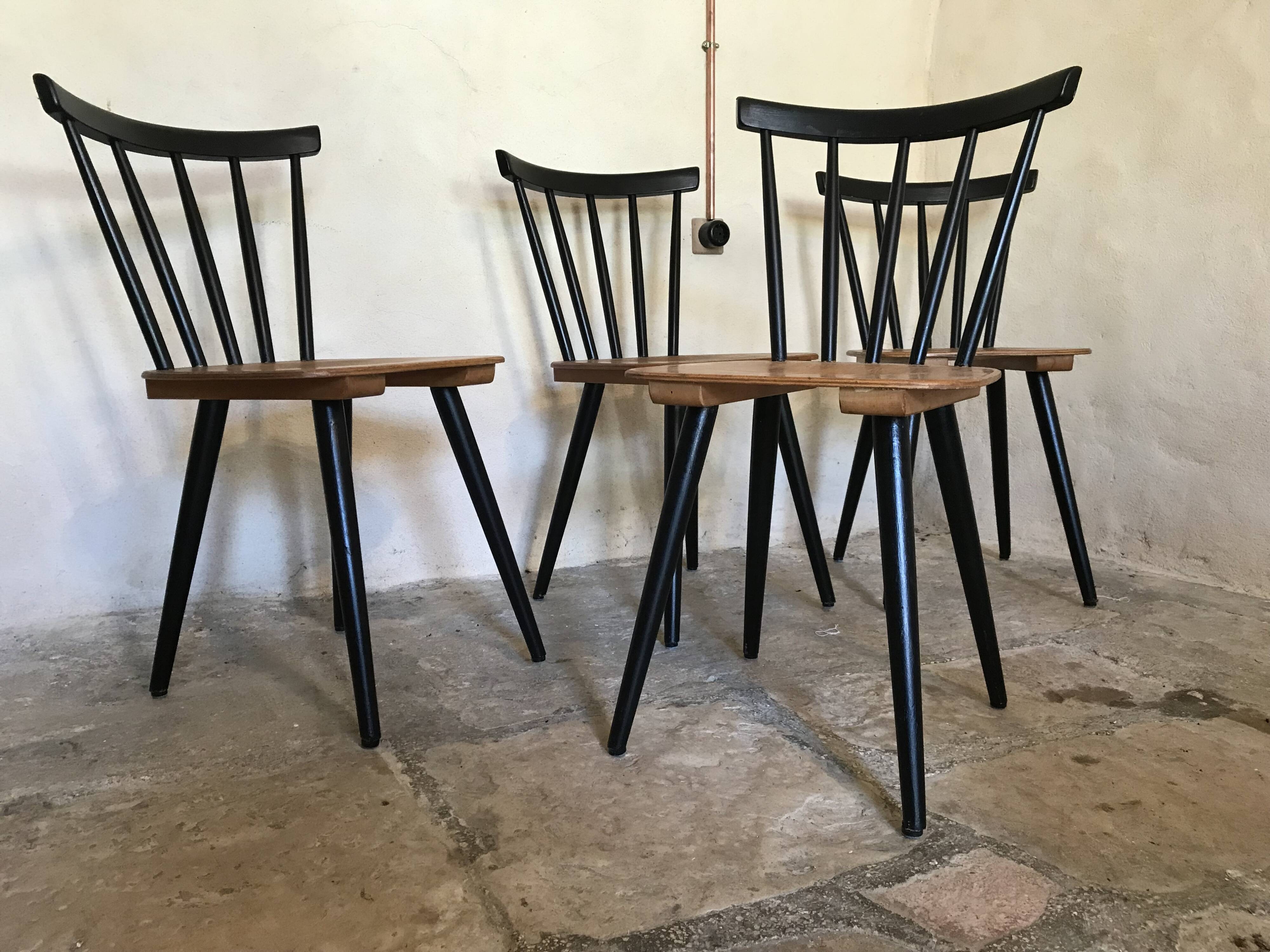 Set of 4 vintage 1960's chairs with bars and black compass legs