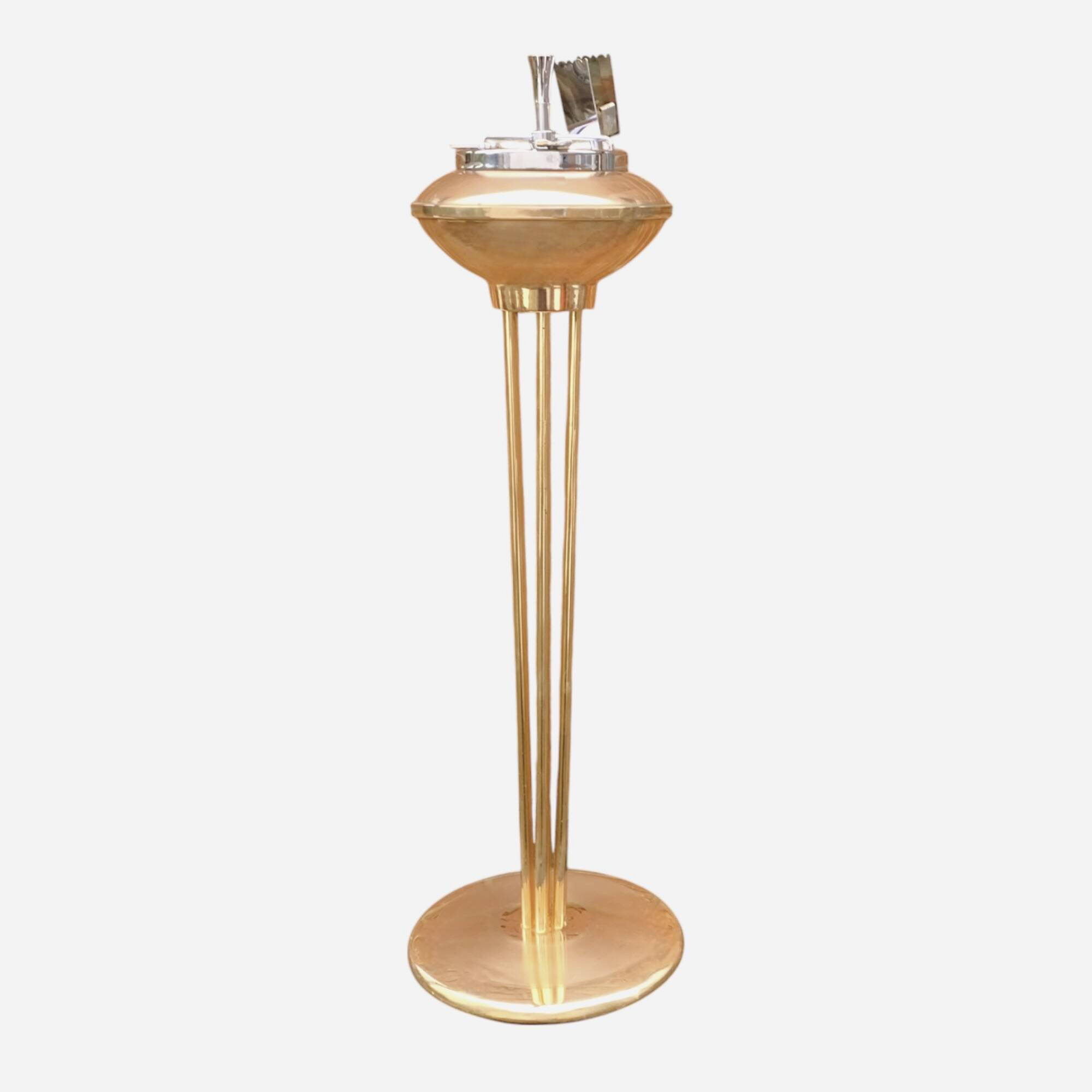 Old brass and chrome-plated metal ashtray on stand