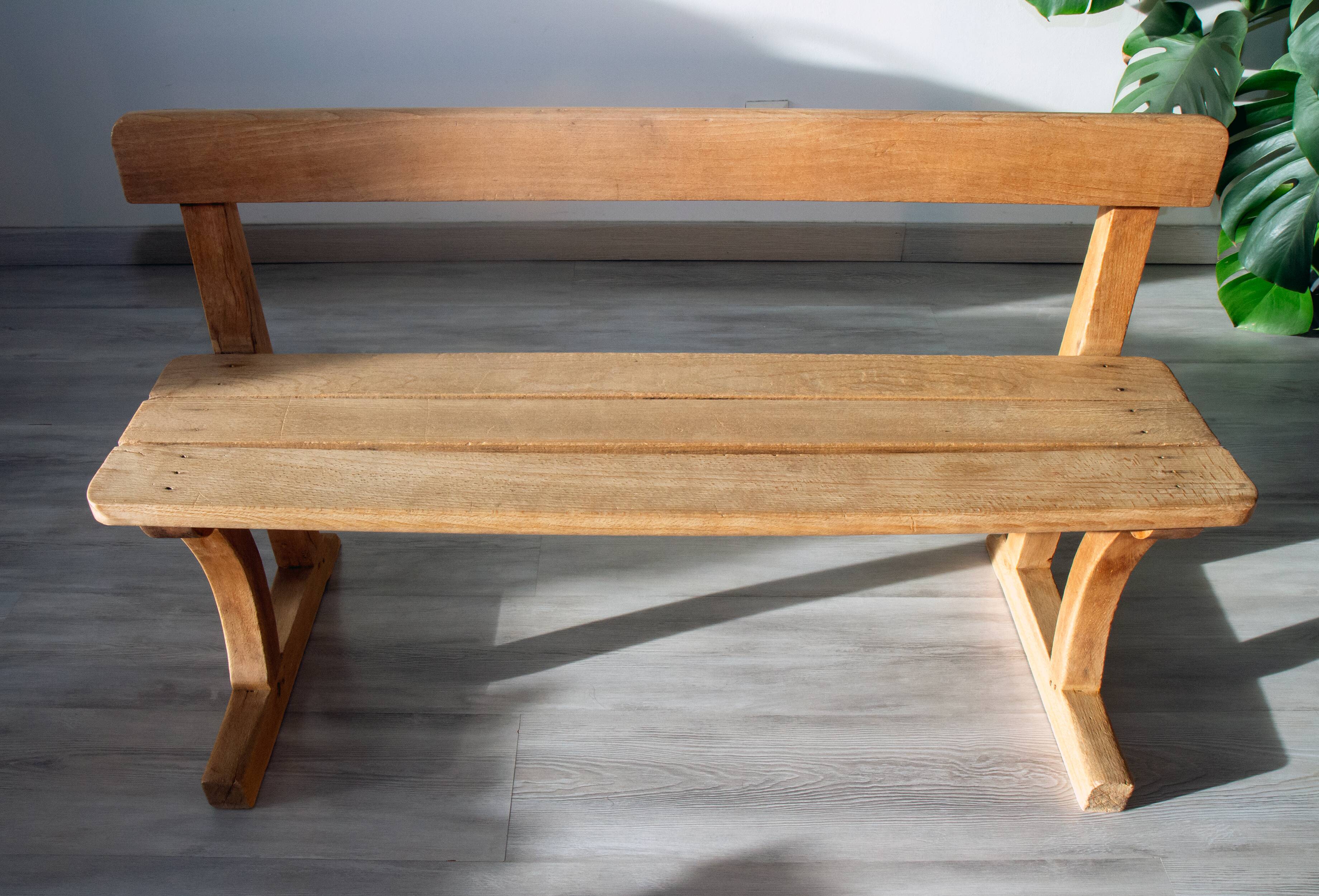 Solid wood school bench from the early 20th century.