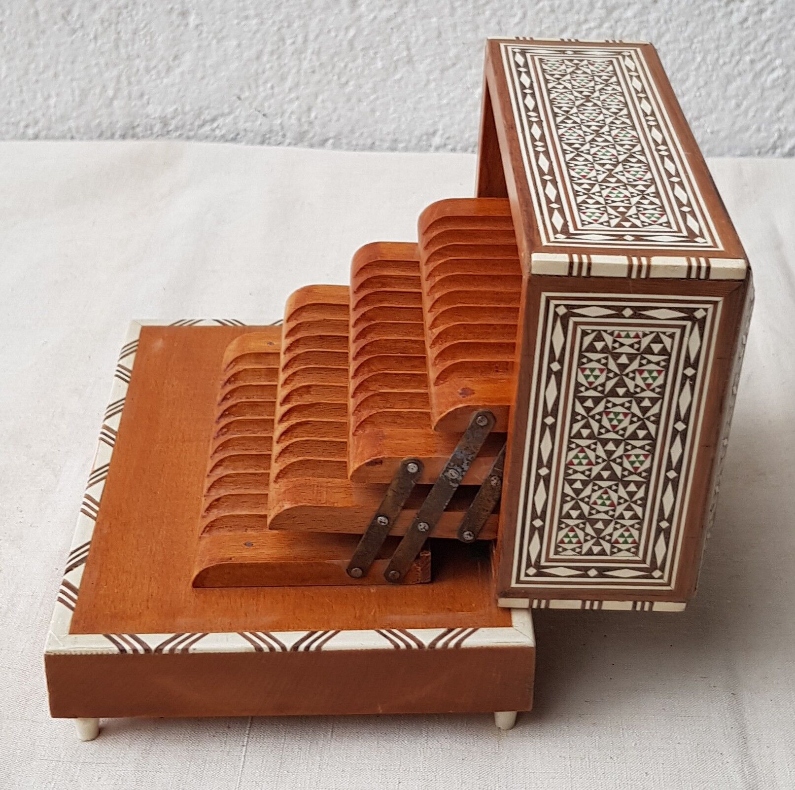Wood cigarette box and mother-of-pearl inclusion