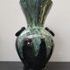 Old black enamelled ceramic Gaubier vase with green white vintage drips