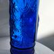 cobalt blue molded glass bottle in relief decoration bunches of grapes