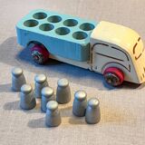 Small wooden milk truck with its cans, antique toy