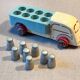 Small wooden milk truck with its cans, antique toy