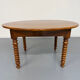 Oval dining table in solid wood with turned legs from the 1950s.