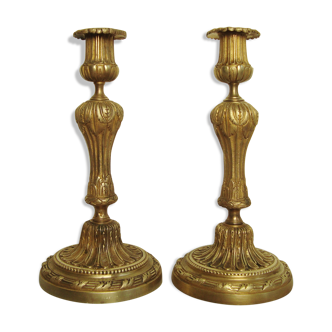 Pair of old bronze candlesticks with acanthus leaves and pearls