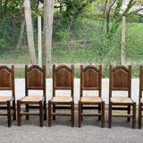 6 dining chairs in a country or farmhouse style, made of dark solid wood and rush-seated.