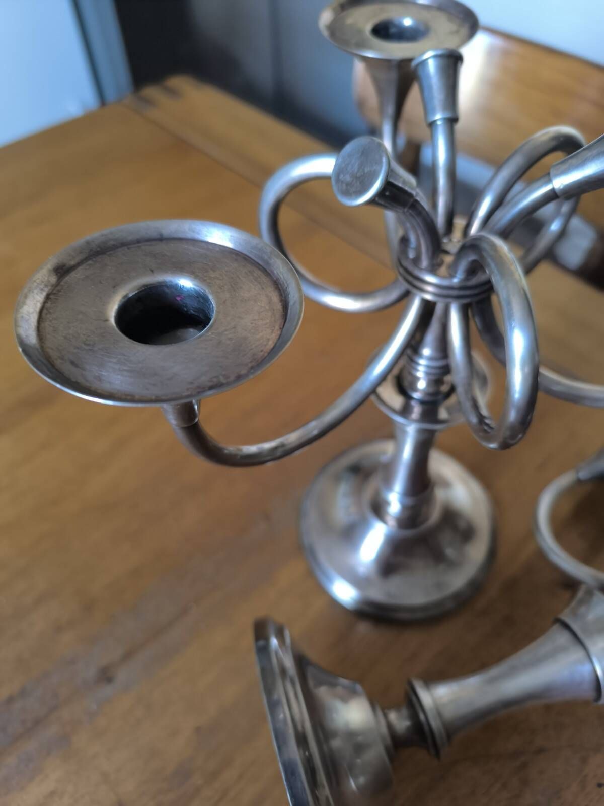 Ercuis pair of candlesticks model Cheverny in silver-plated metal with hunting horn decoration.