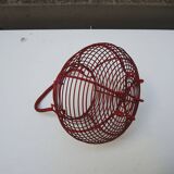 Old red-painted metal egg basket