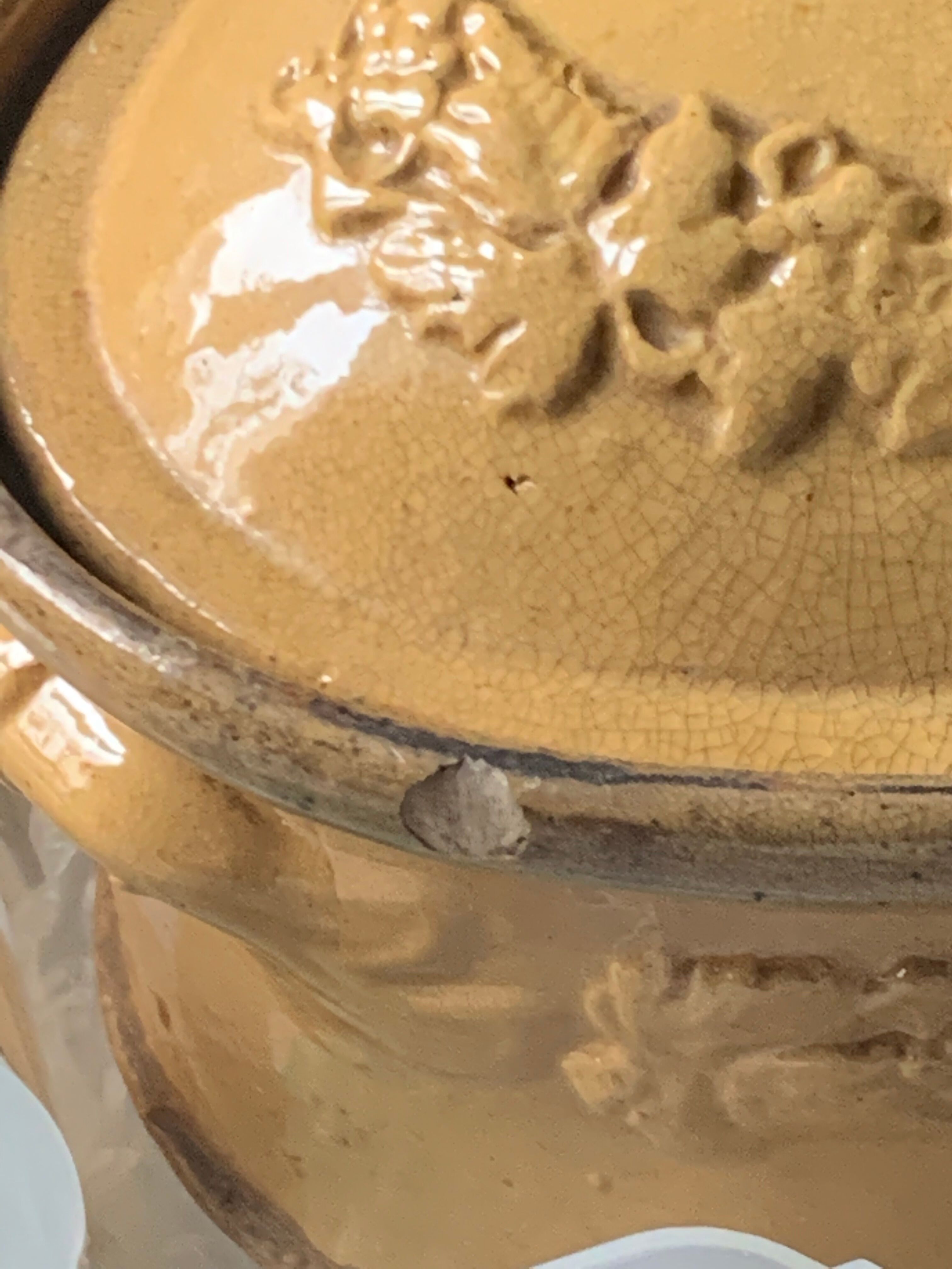 Old terrine in glazed stoneware and floral decoration mustard yellow slip