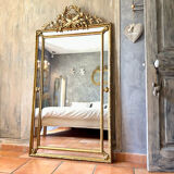 Antique gilded mirror with parcloses from the 19th century.
