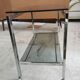 Side table, serving table, console in glass and chrome metal.