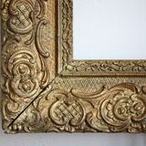 Gilded wooden and stucco frame