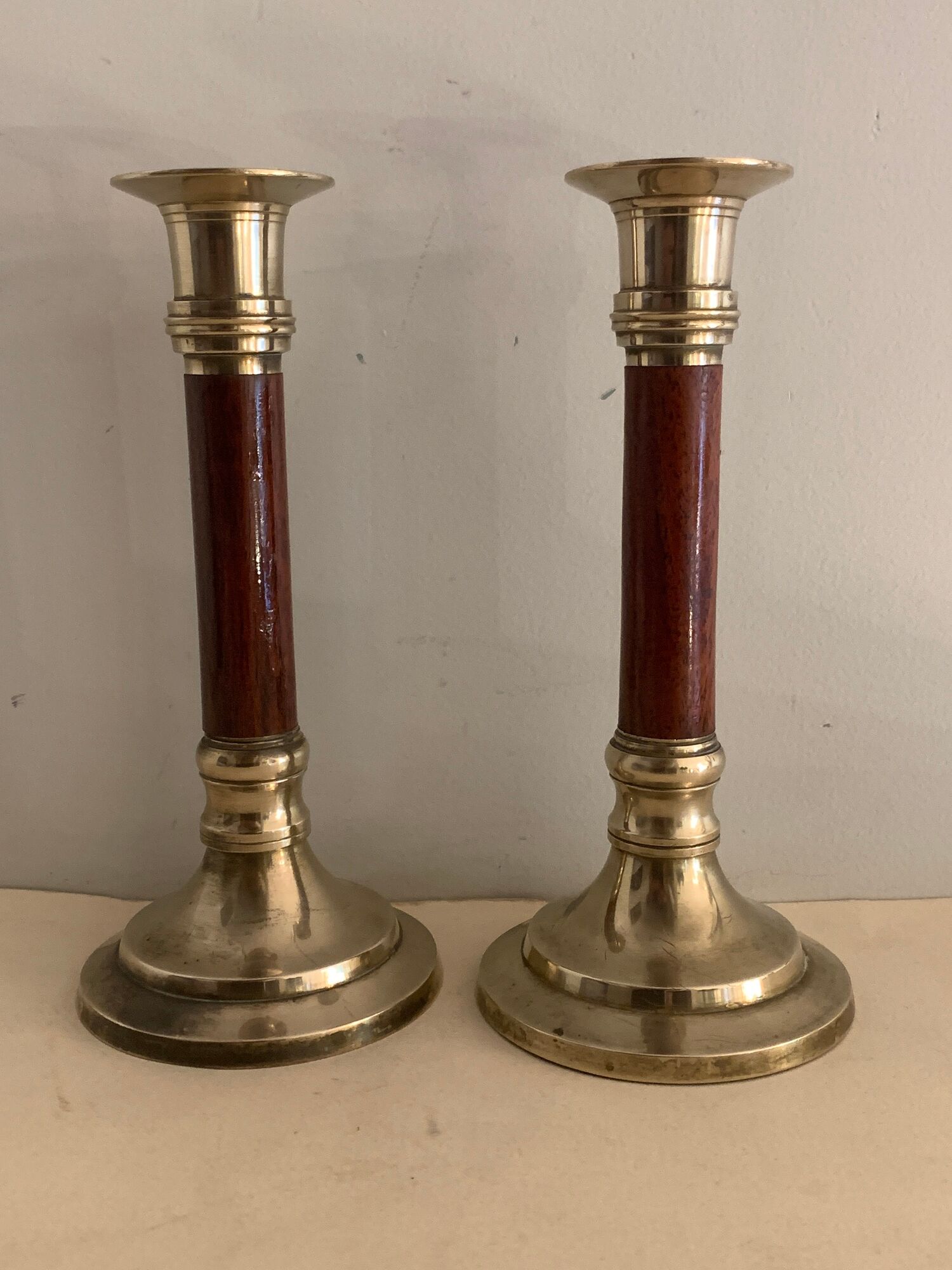 Pair of brass and mahogany wood candle holders