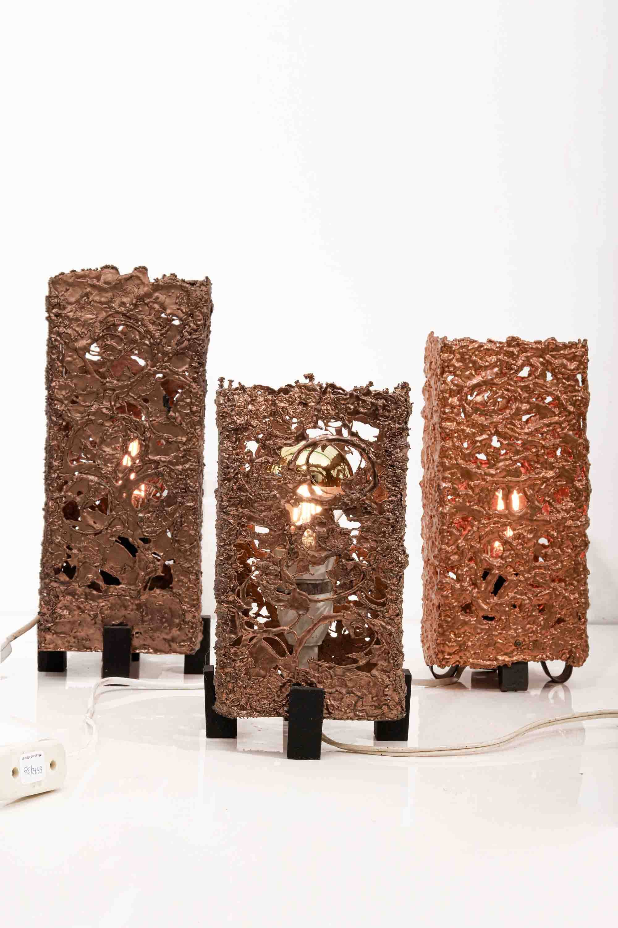 Set of 3 Finnish Aimo Tukiainen lamps in cast copper, 1960s."