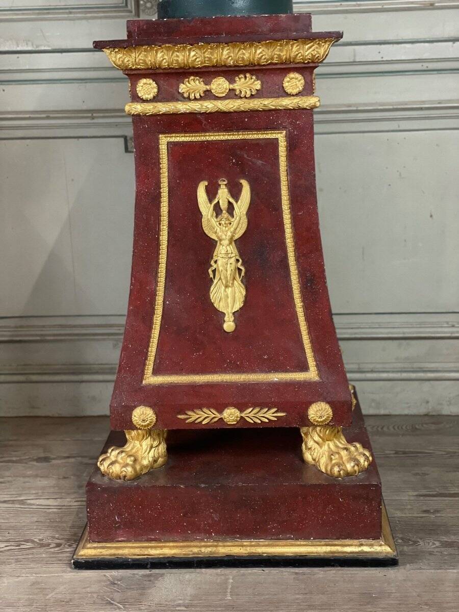 Pair of plaster bases imitating porphyry and gilded bronze circa 1980.