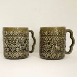 Duo of BP 70's slip mugs