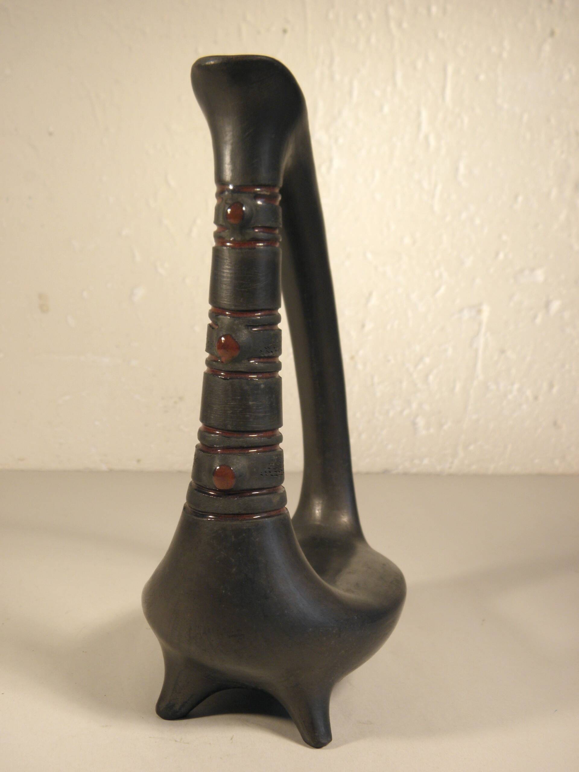 Zoomorphic pitcher vase in black ceramic