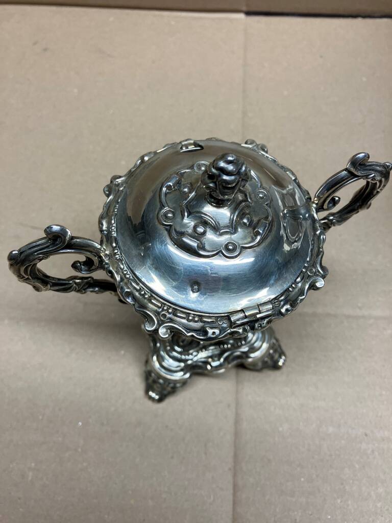 A lovely Regency-style silver mustard pot from the 19th century.