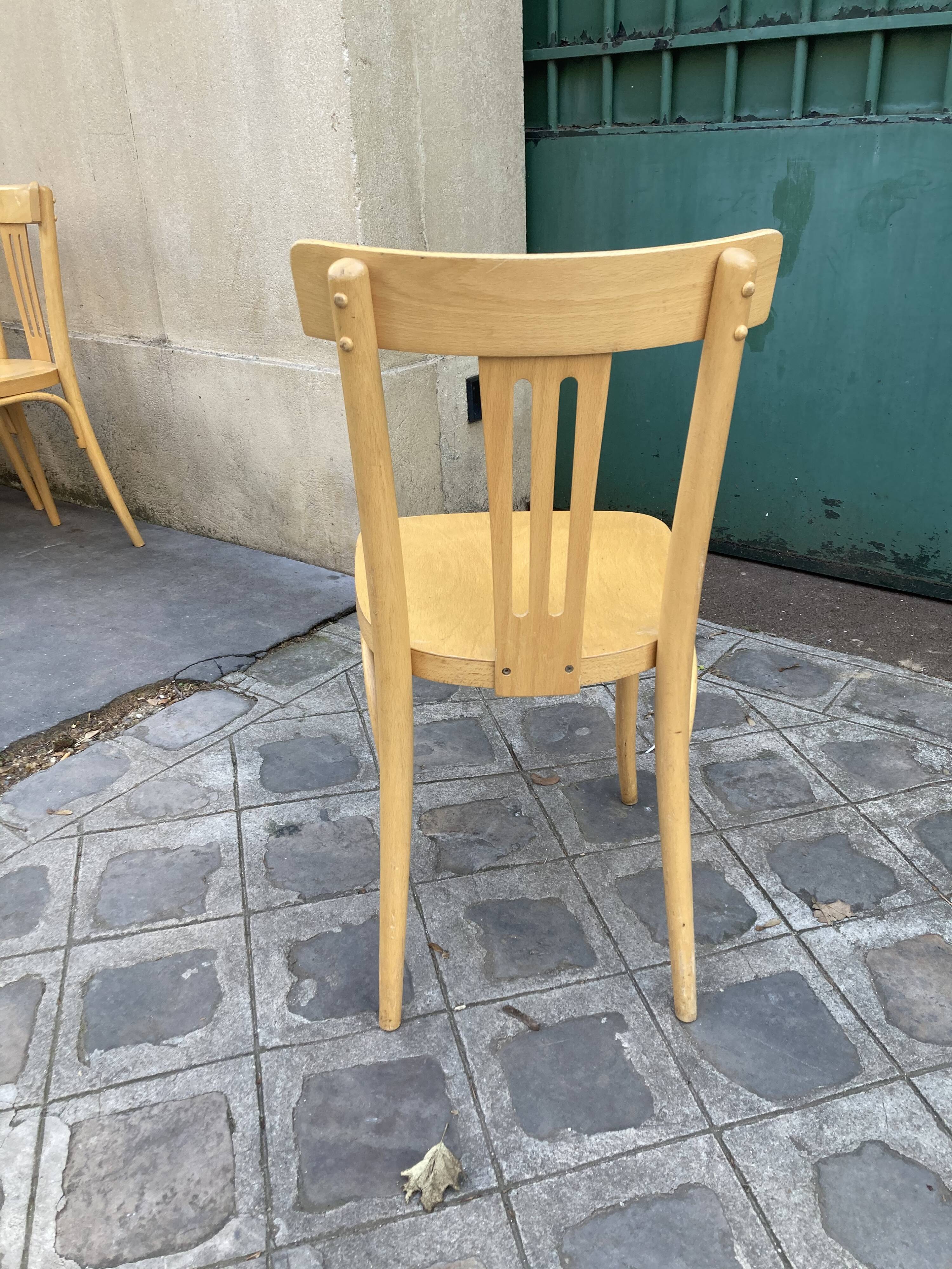 Set of 10 bistro chairs in light beech.