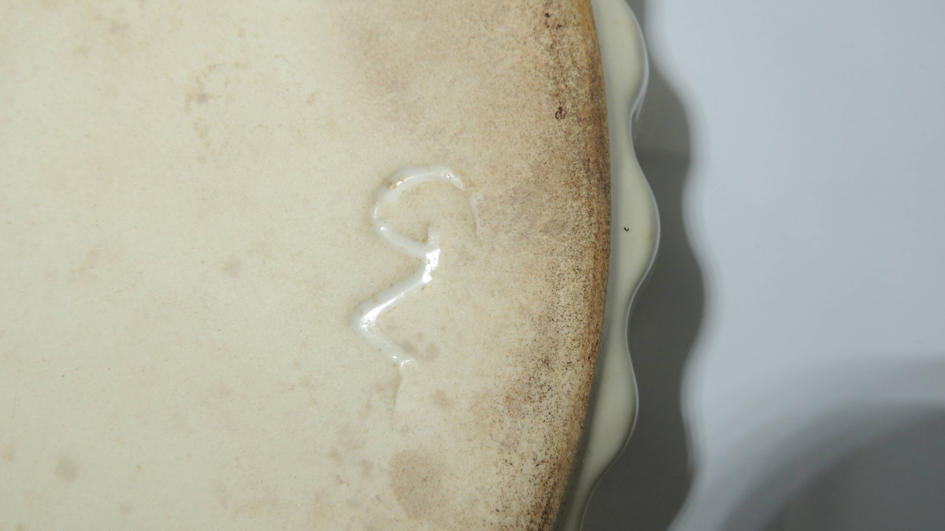 Magnificent fruit tart dish in slip signed "What's Vincent Cadeaux