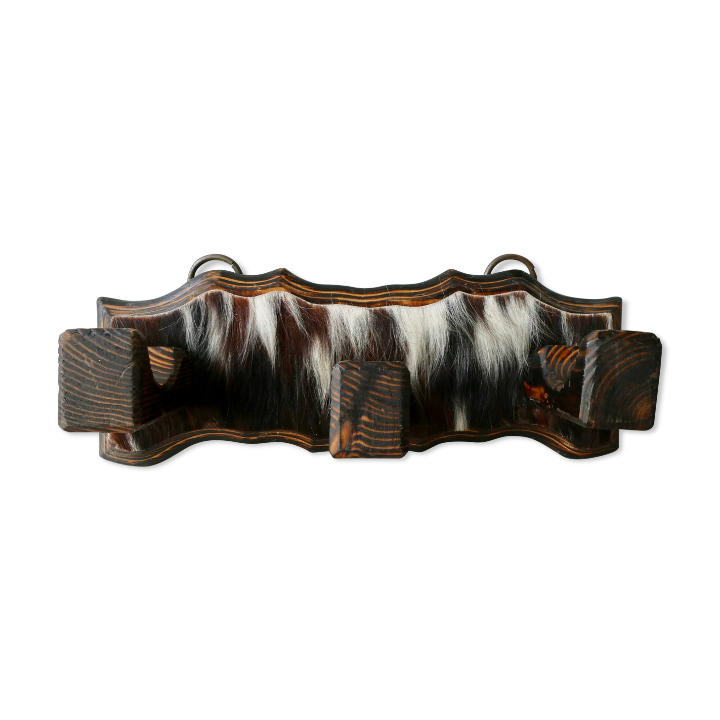 Wall hanger in burnt pine and cow skin