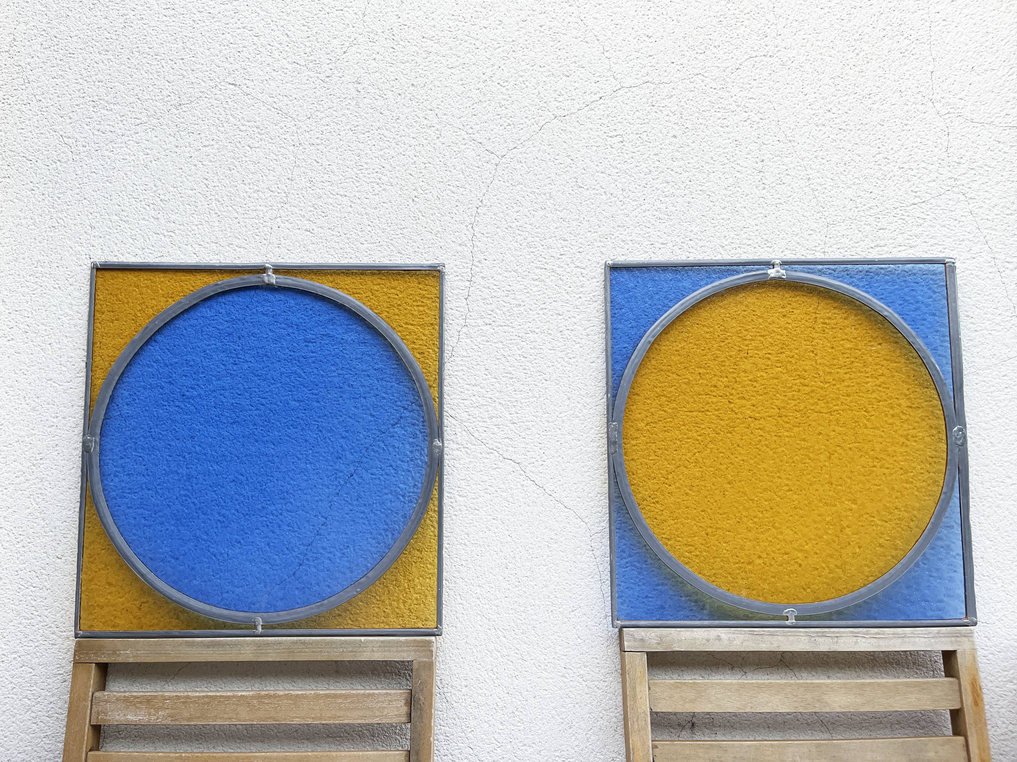 Pair of antique blue and yellow stained glass windows