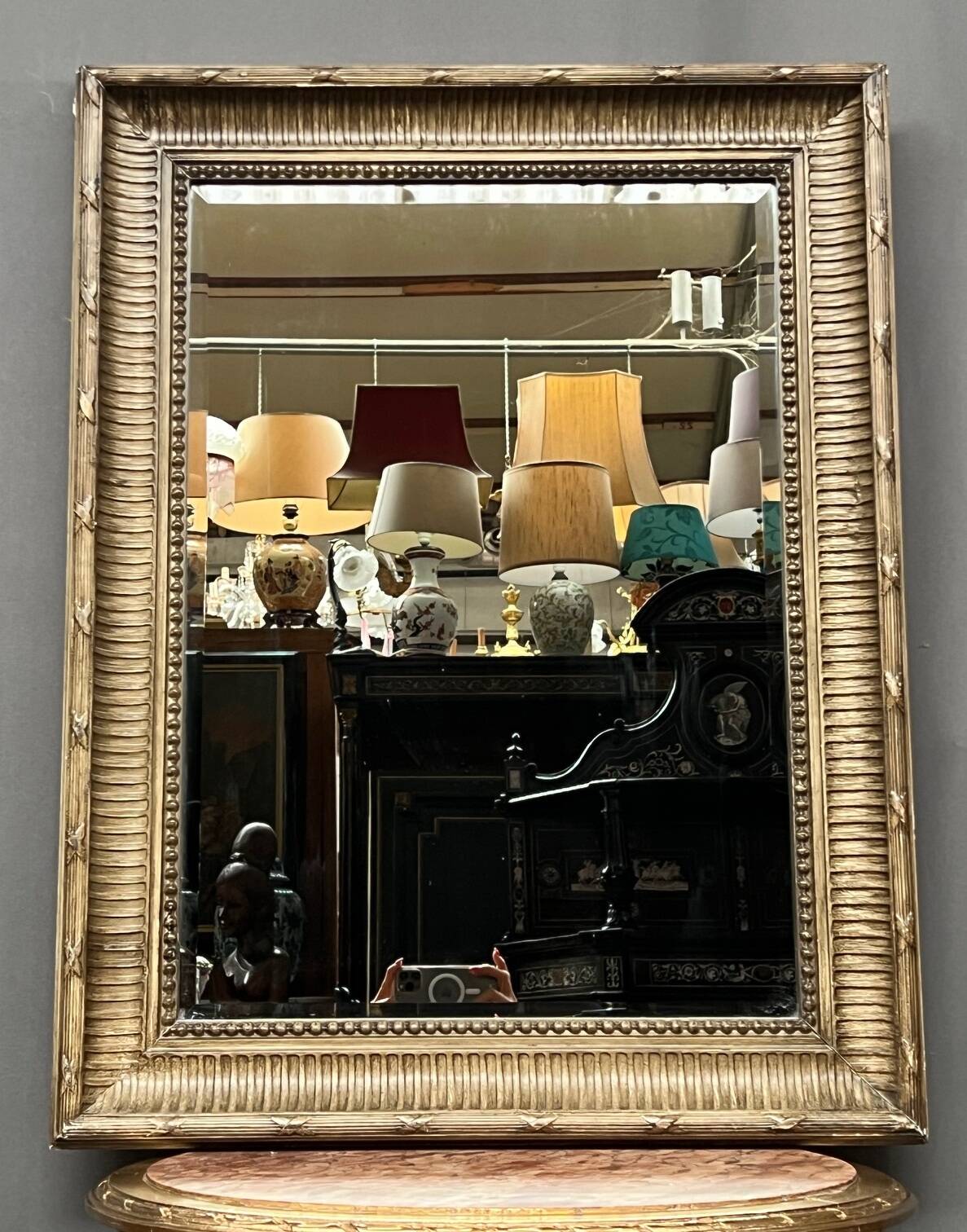 Mirror in a frame with a moulding.