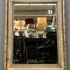 Mirror in a frame with a moulding.