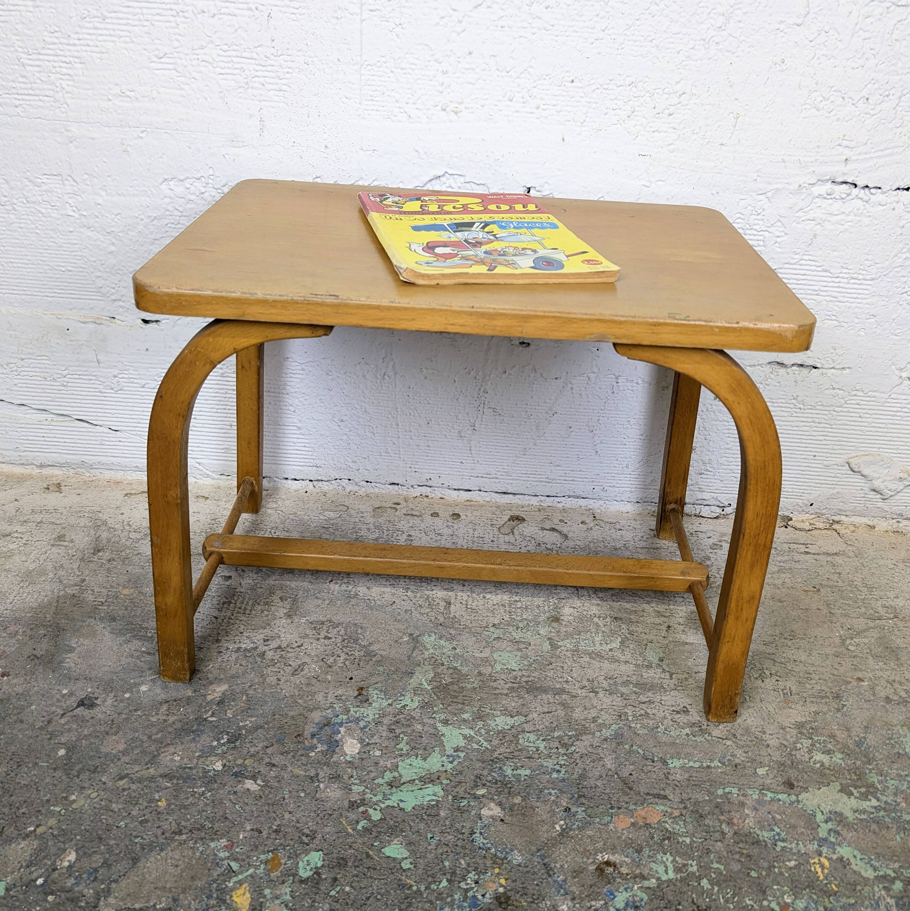 Old curved wooden children's desk.