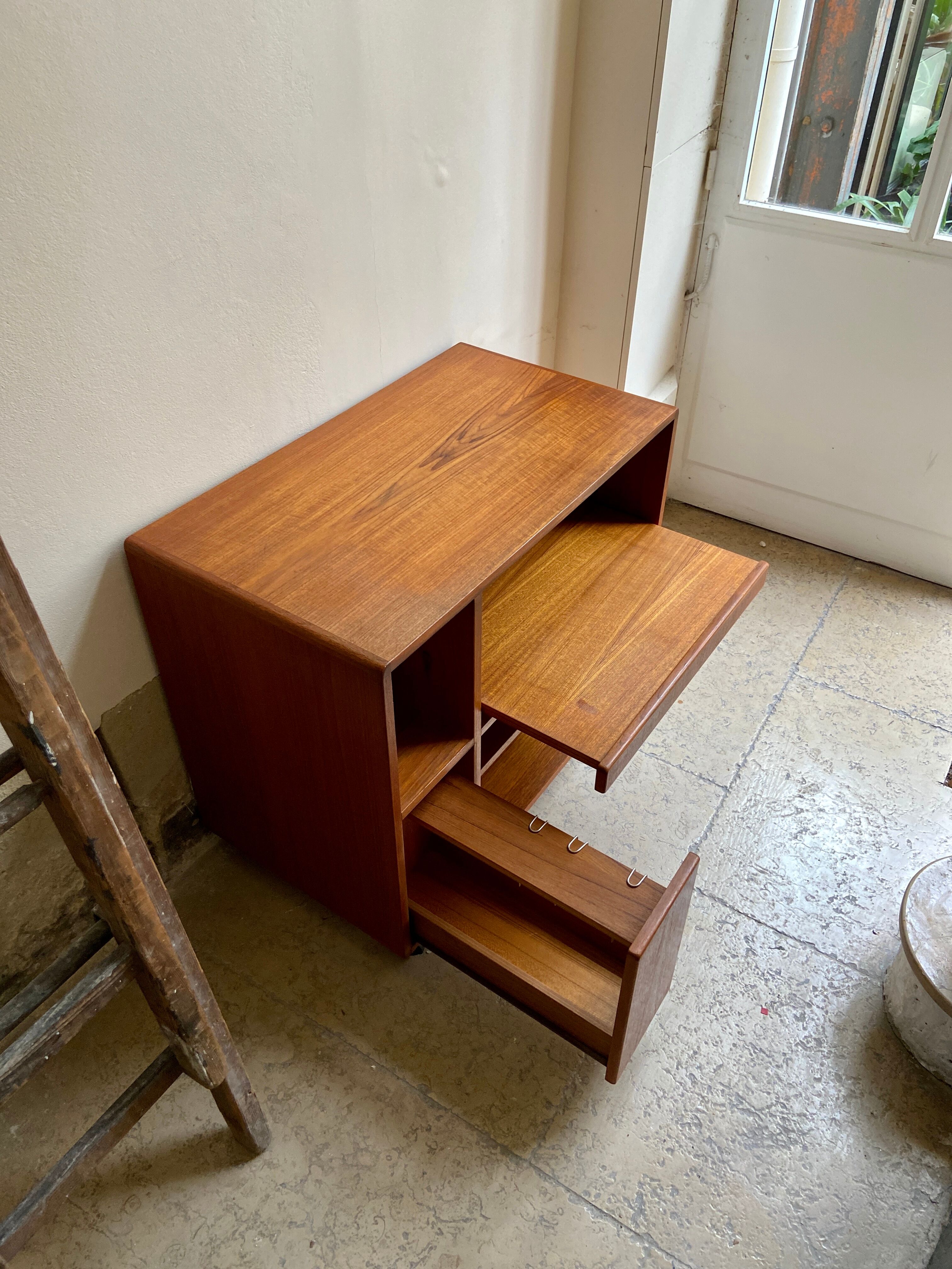 Danish storage cabinet Komfort on teak and rosewood wheels
