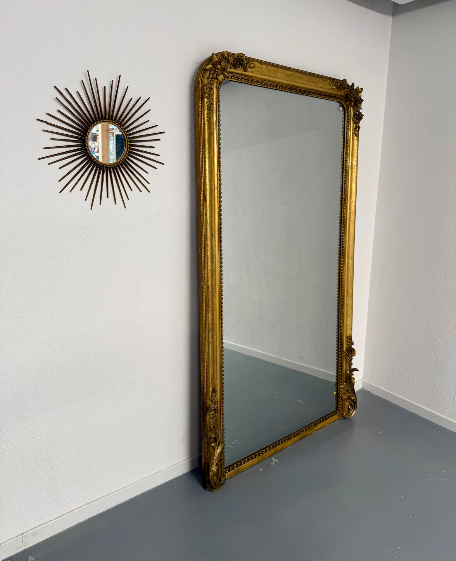 Large Napoleon III mirror with wooden gilded frame, 19th century, 200 cm.