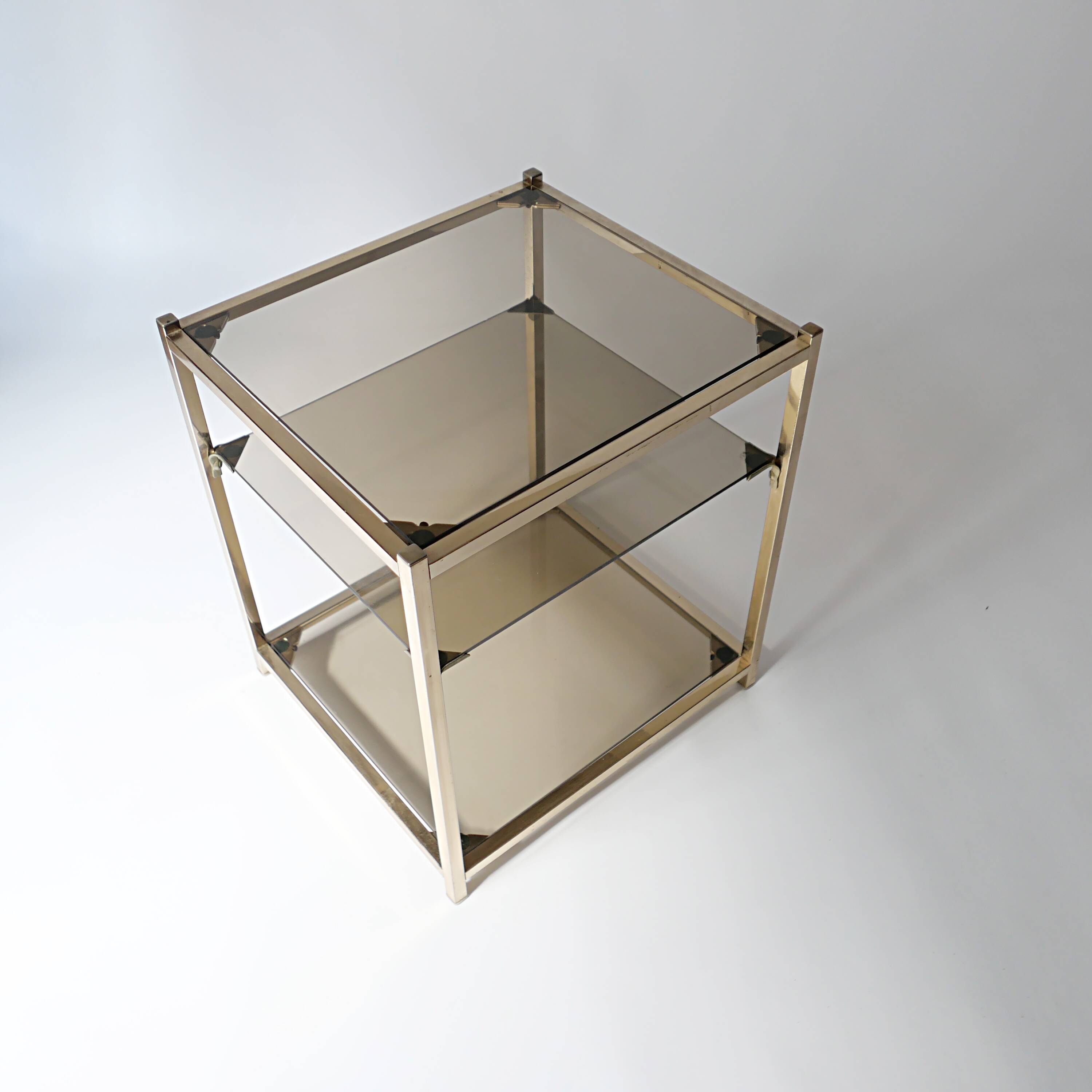 vintage coffee table design 1960s 1970s in gold metal and smoked glass