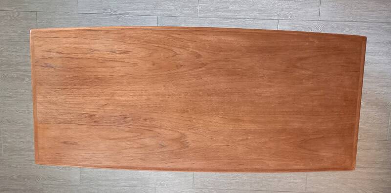 Danish 1960s teak coffee table with slatted shelf.
