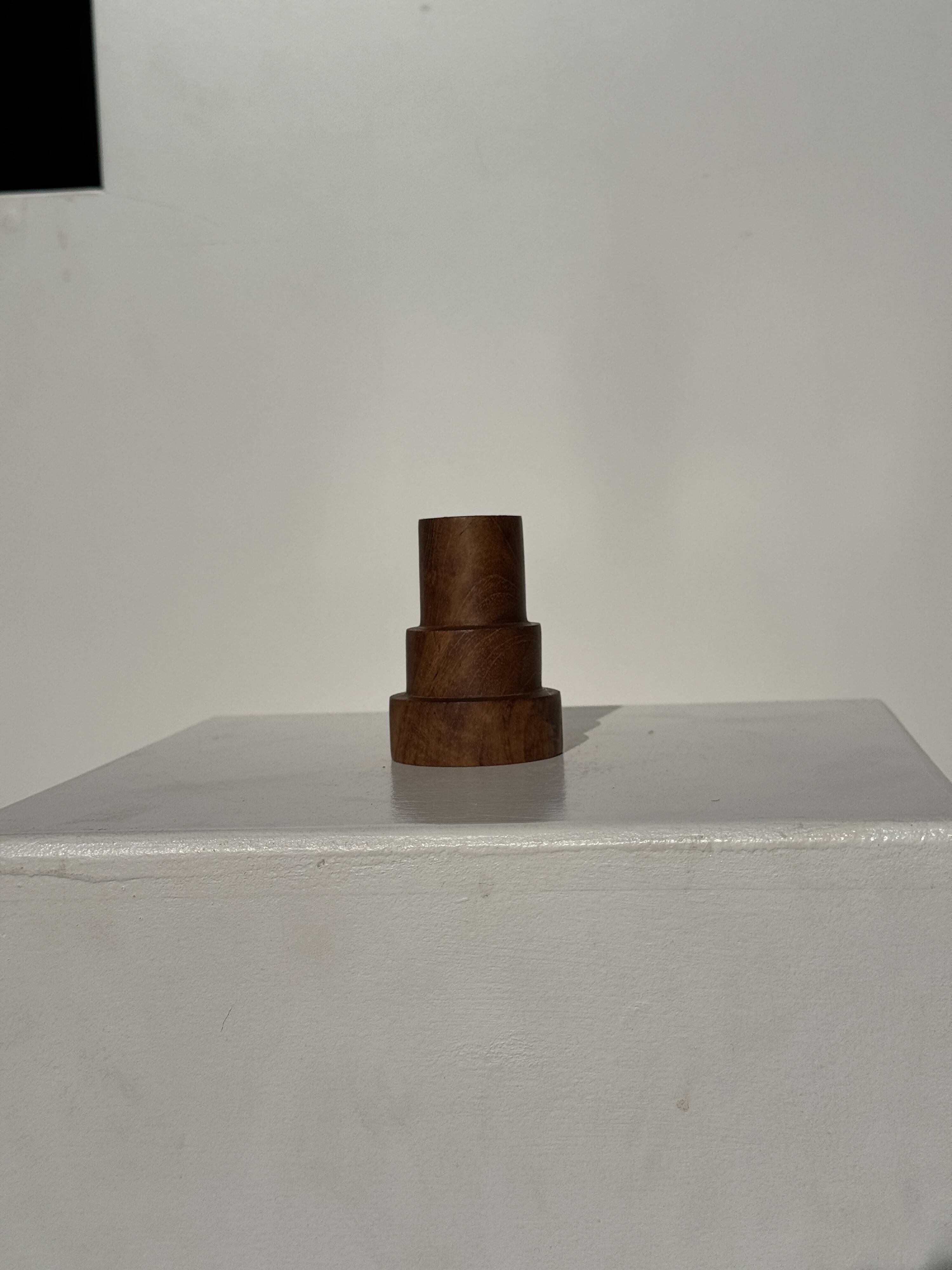 Pyramidal circular teak monoxyle candlestick H7 D5