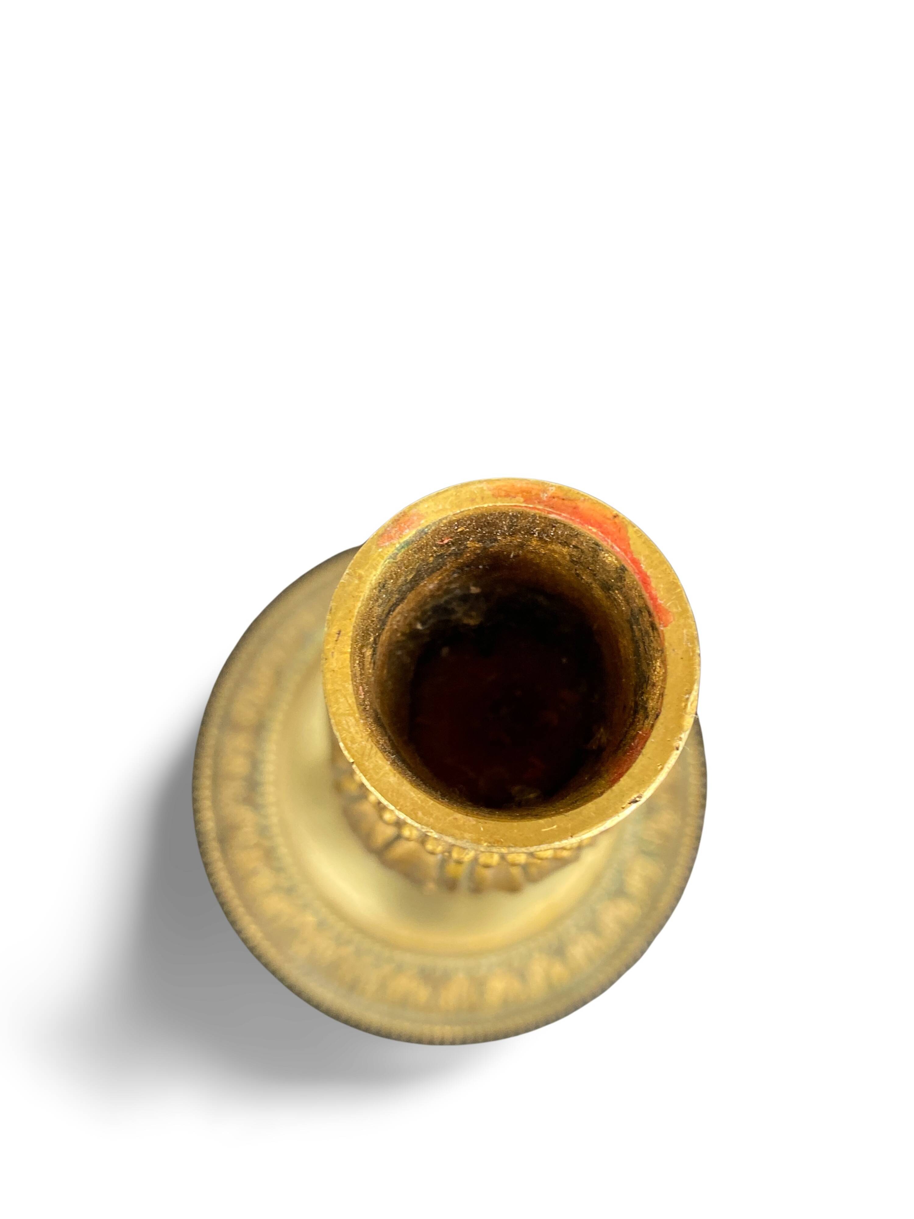 Louis XVI period candlestick in chiseled gilt bronze