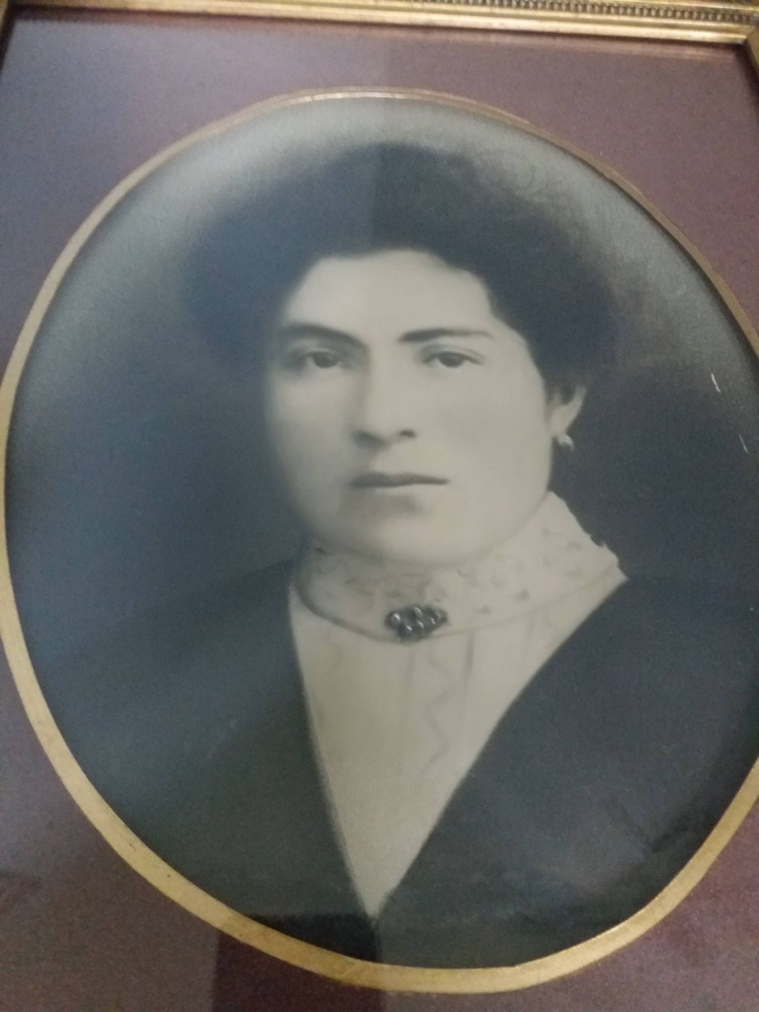 Old photo portrait framed in wood and stucco
